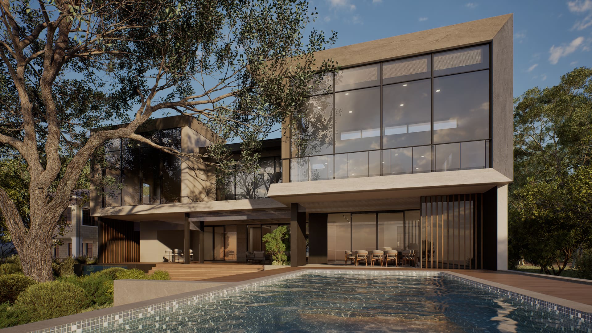 528 Wampler Drive at dusk — the waterfront elevation, pool terrace and double-height glazing